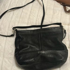 This coach purse is black pebble leather
